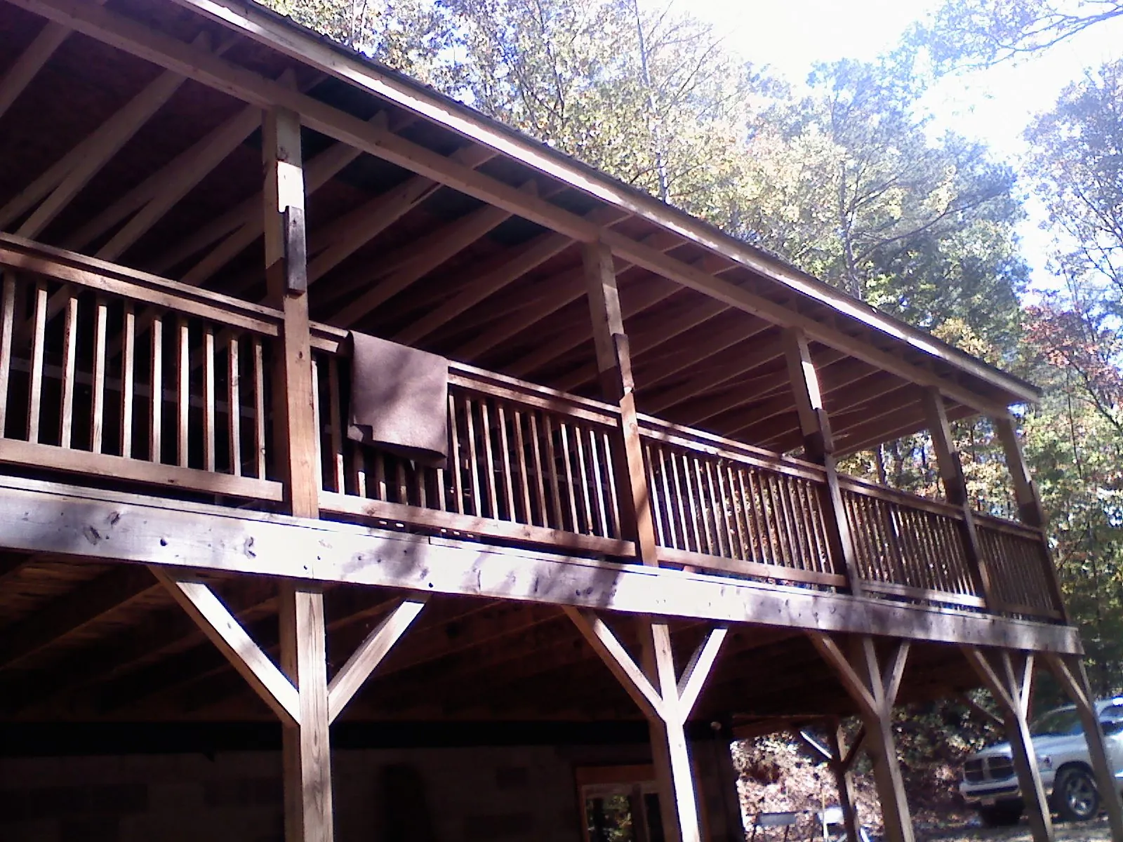 Timber framing under a new elevated porch and deck — Roof Leak Repair in Powers Lake by Roofing Brothers
